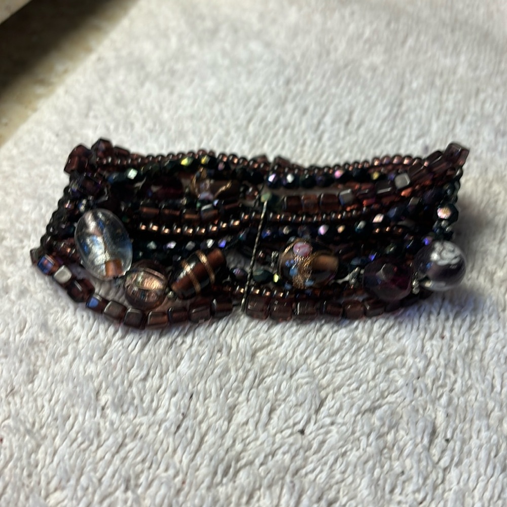Stretchy beaded bracelet in deep purple beads. 8” circumference.